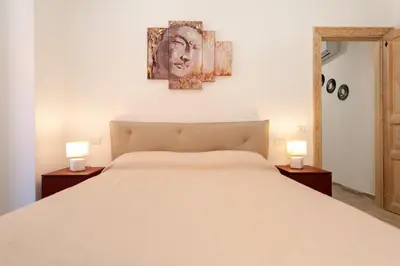 Letto o letti in una camera di DOMO ALLE
