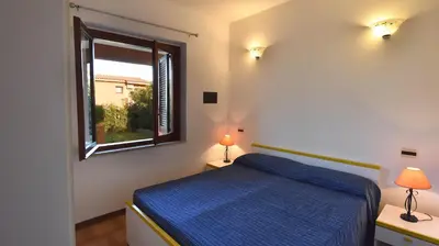 Letto o letti in una camera di Residence Il Vascello