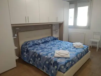 Letto o letti in una camera di APPARTAMENTO 5 pers PARCHEGGIO