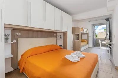 Letto o letti in una camera di CAMERA con Parcheggio max 3PERS, BAGNO