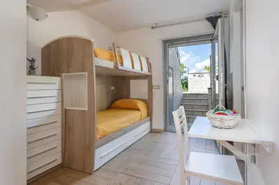 Letto o letti in una camera di CAMERA con Parcheggio max 3PERS, BAGNO