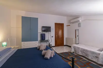 Letto o letti in una camera di B&B SA SPIGA