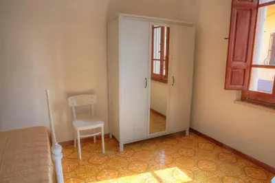 Letto o letti in una camera di Casa dei pescatori