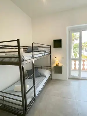 Letto o letti in una camera di Poetto Beach House-Ausonia