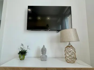 TV o dispositivi per l'intrattenimento presso Poetto Beach House-Ausonia