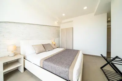 Letto o letti in una camera di Poseidon Rooms