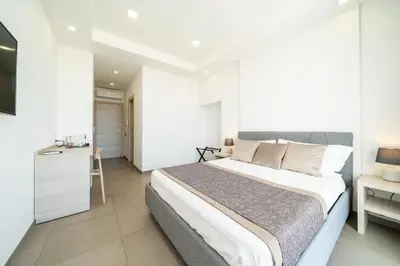 Letto o letti in una camera di Poseidon Rooms
