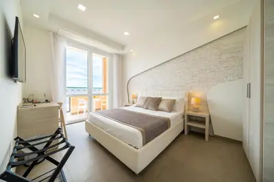 Letto o letti in una camera di Poseidon Rooms