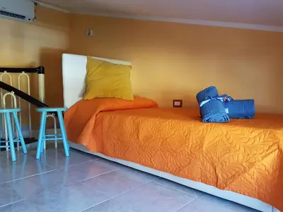 Letto o letti in una camera di The Yellow House IUN P3446