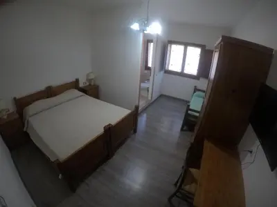 Letto o letti in una camera di Agriturismo Su Meurreddu