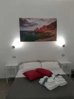 Letto o letti in una camera di Borgo Marinaro La Medusa Arbatax - camera matrimoniale con bagno privato-