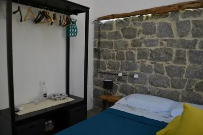 Letto o letti in una camera di Borgo Marinaro La Medusa Arbatax - camera matrimoniale con bagno privato-