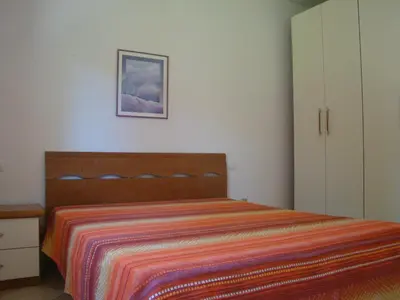 Letto o letti in una camera di Appartamento Deledda
