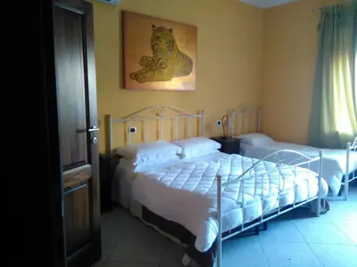 Letto o letti in una camera di Villa Donna Maria