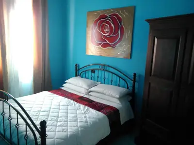 Letto o letti in una camera di Villa Donna Maria