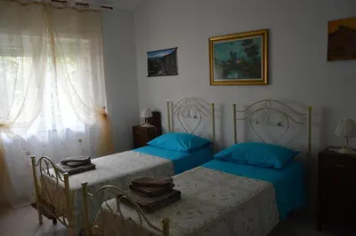 Letto o letti in una camera di Pietro & Graziella