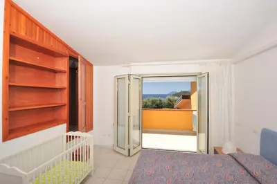 Letto o letti in una camera di Arbatax Le Terrazze sul Mare