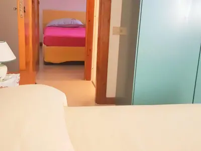 Letto o letti in una camera di Villa dell'Arte Vista Mare