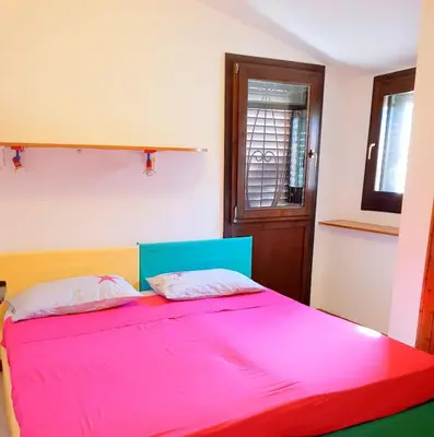 Letto o letti in una camera di Villa dell'Arte Vista Mare