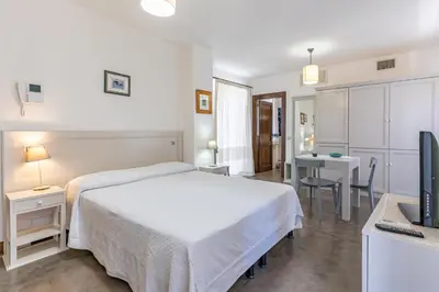 Letto o letti in una camera di Albergo Residenziale La Corte