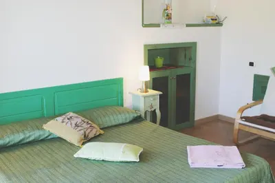 Letto o letti in una camera di B&B S'ARROSA ANTIGA