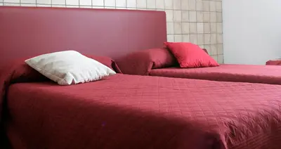 Letto o letti in una camera di B&B S'ARROSA ANTIGA