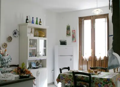 Cucina o angolo cottura di B&B S'ARROSA ANTIGA