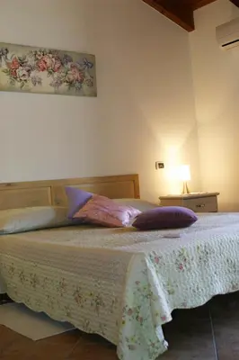 Letto o letti in una camera di B&B S'ARROSA ANTIGA