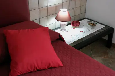 Letto o letti in una camera di B&B S'ARROSA ANTIGA