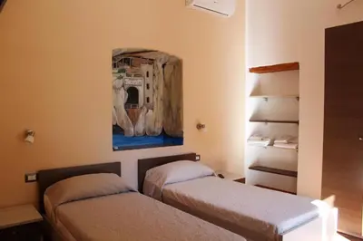 Letto o letti in una camera di Room and Breakfast I Gemelli