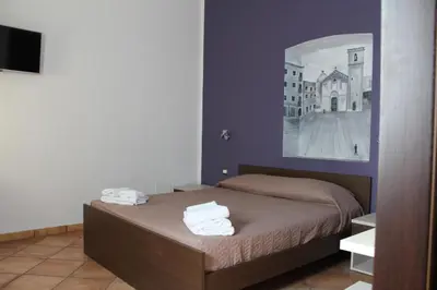 Letto o letti in una camera di Room and Breakfast I Gemelli