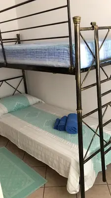 Letto o letti in una camera di CAMY Apartment Scopri Tortolì Appartamento Centrale vicino alle Spiagge!