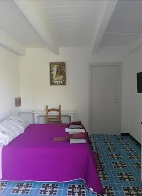 Letto o letti in una camera di Il giardino di Don Peppino
