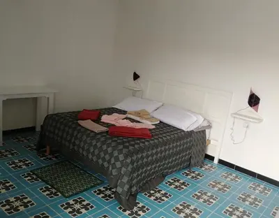 Letto o letti in una camera di Il giardino di Don Peppino