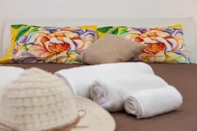 Letto o letti in una camera di APPARTAMENTI GAIMARO' a 50 m dalla spiaggia