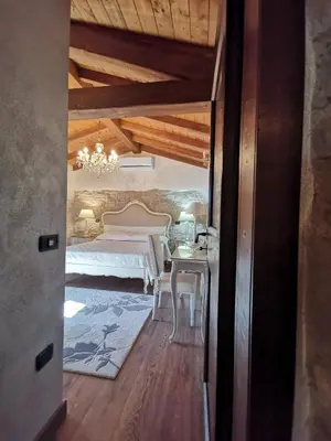 Letto o letti in una camera di L'Antica Dimora - Suites & Apartments
