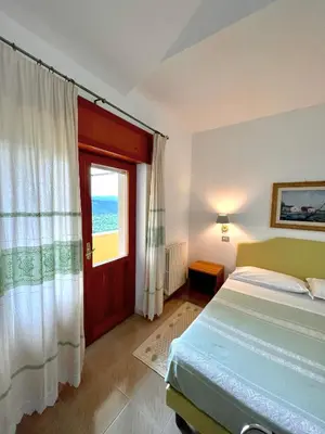 Letto o letti in una camera di Hotel La Capannina