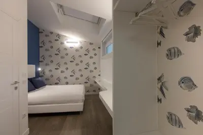 Letto o letti in una camera di La Porta sulla spiaggia Casa vacanze