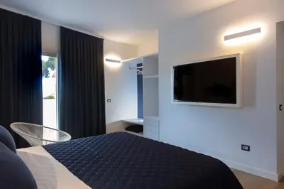 TV o dispositivi per l'intrattenimento presso La Porta sulla spiaggia Casa vacanze