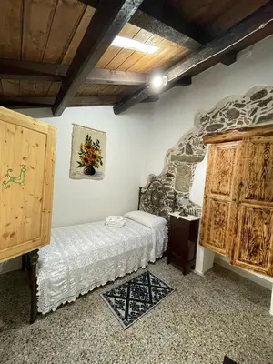 Letto o letti in una camera di Casa Murroni