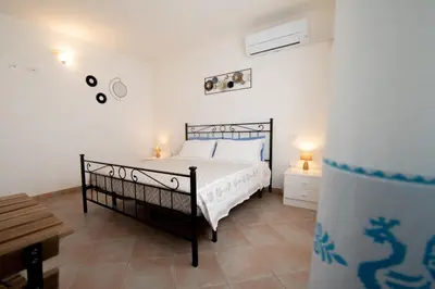Letto o letti in una camera di Casa Martina