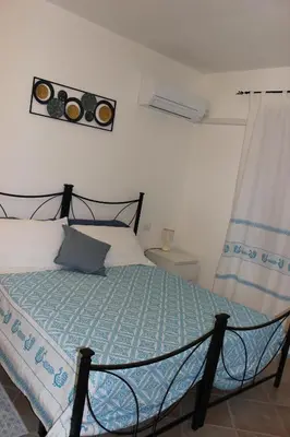 Letto o letti in una camera di Casa Martina