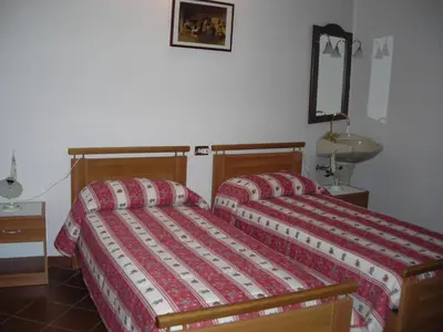 Letto o letti in una camera di B&B Il Vigneto