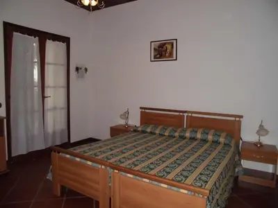 Letto o letti in una camera di B&B Il Vigneto