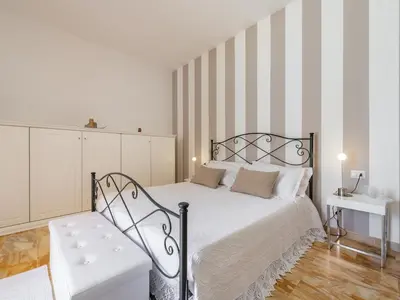 Letto o letti in una camera di Villa Iole