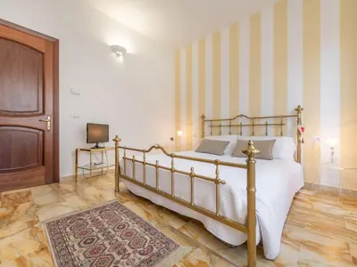 Letto o letti in una camera di Villa Iole