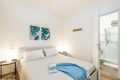 Letto o letti in una camera di Acquazzurra Rooms