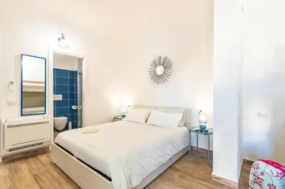 Letto o letti in una camera di Acquazzurra Rooms