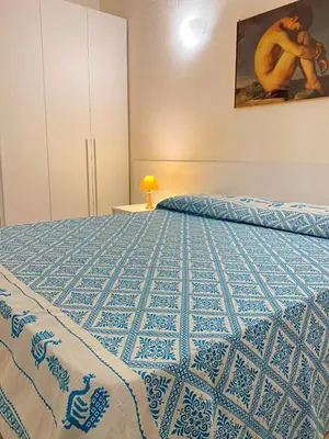 Letto o letti in una camera di Villa Caterina a pochi passi dalla spiaggia con 3 Camere e Giardino Privato