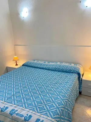 Letto o letti in una camera di Villa Caterina a pochi passi dalla spiaggia con 3 Camere e Giardino Privato